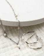 TWIST | SILVER TWISTED HOOP EARRINGS