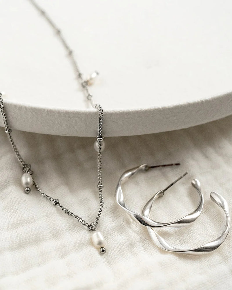 TWIST | SILVER TWISTED HOOP EARRINGS