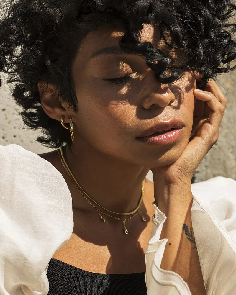TWIST | GOLD TWISTED HOOP EARRINGS