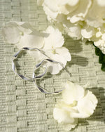 TWIST | SILVER TWISTED HOOP EARRINGS