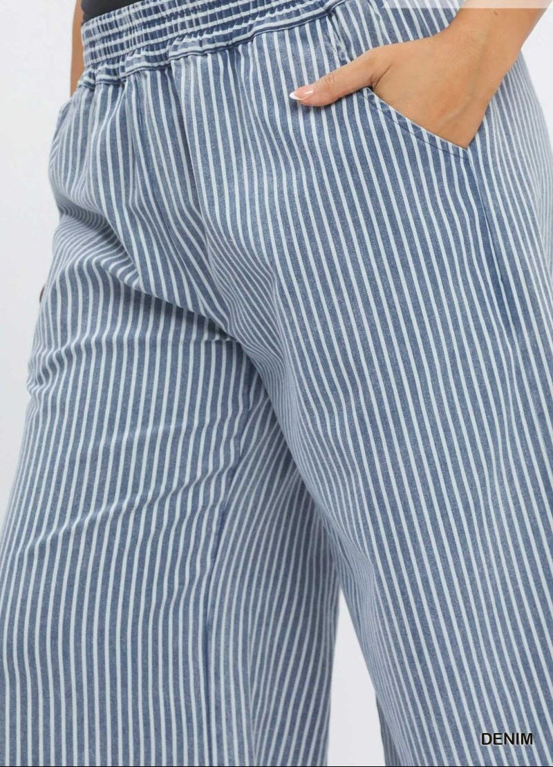 Blue and white striped pants with a plain background