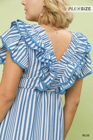 Blue and white striped dress with ruffled details on a green background