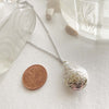 "Song Sung Blue" Floral Design Teardrop Locket Necklace in Silver